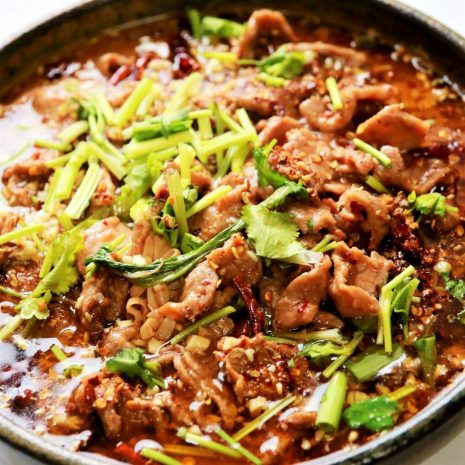 Poached sliced beef and vegetables in hot chili oil