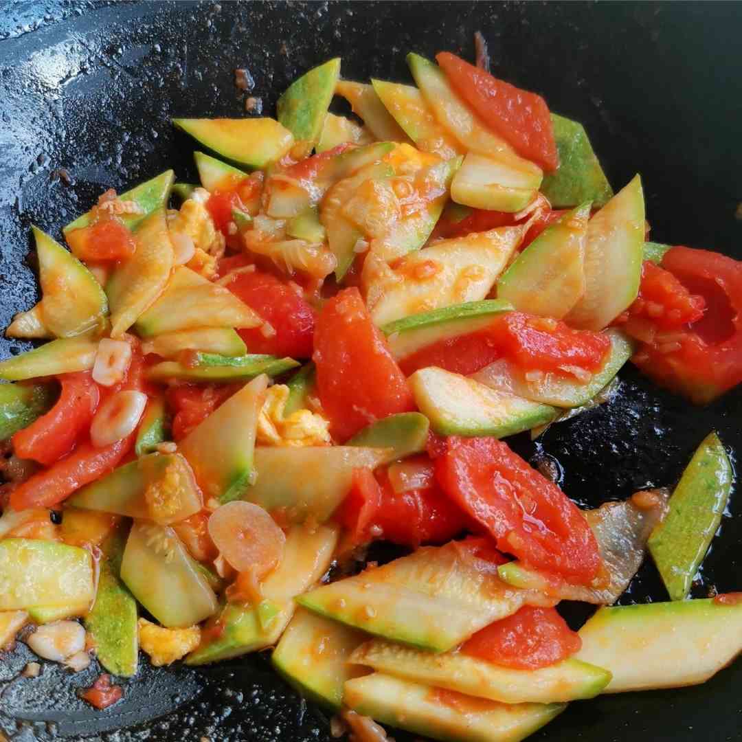 Pour the zucchini slices and stir-fry until slightly softened.