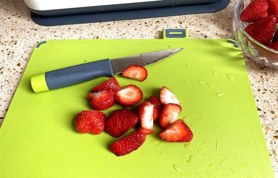 Wash and cut strawberries into small pieces.